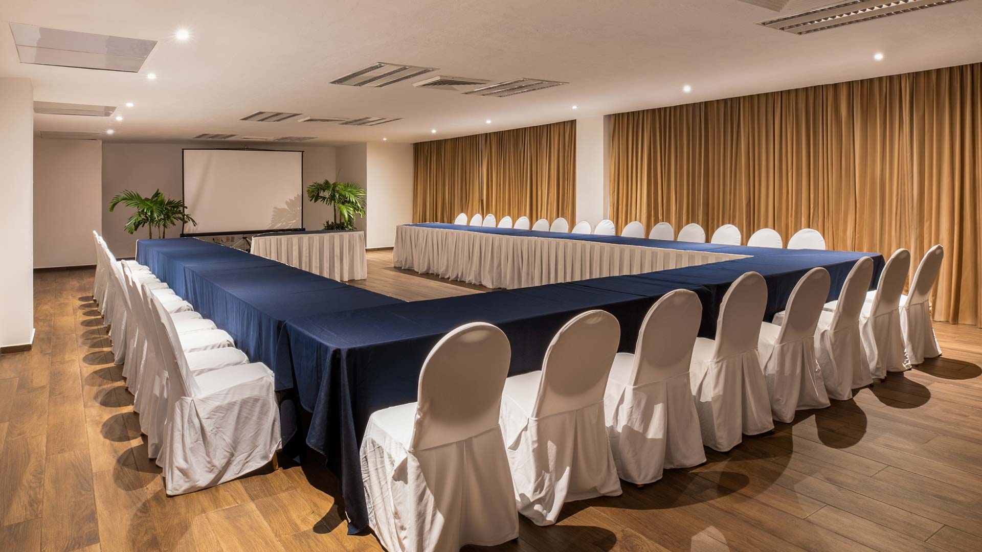 Meeting room with a square conference table and seating