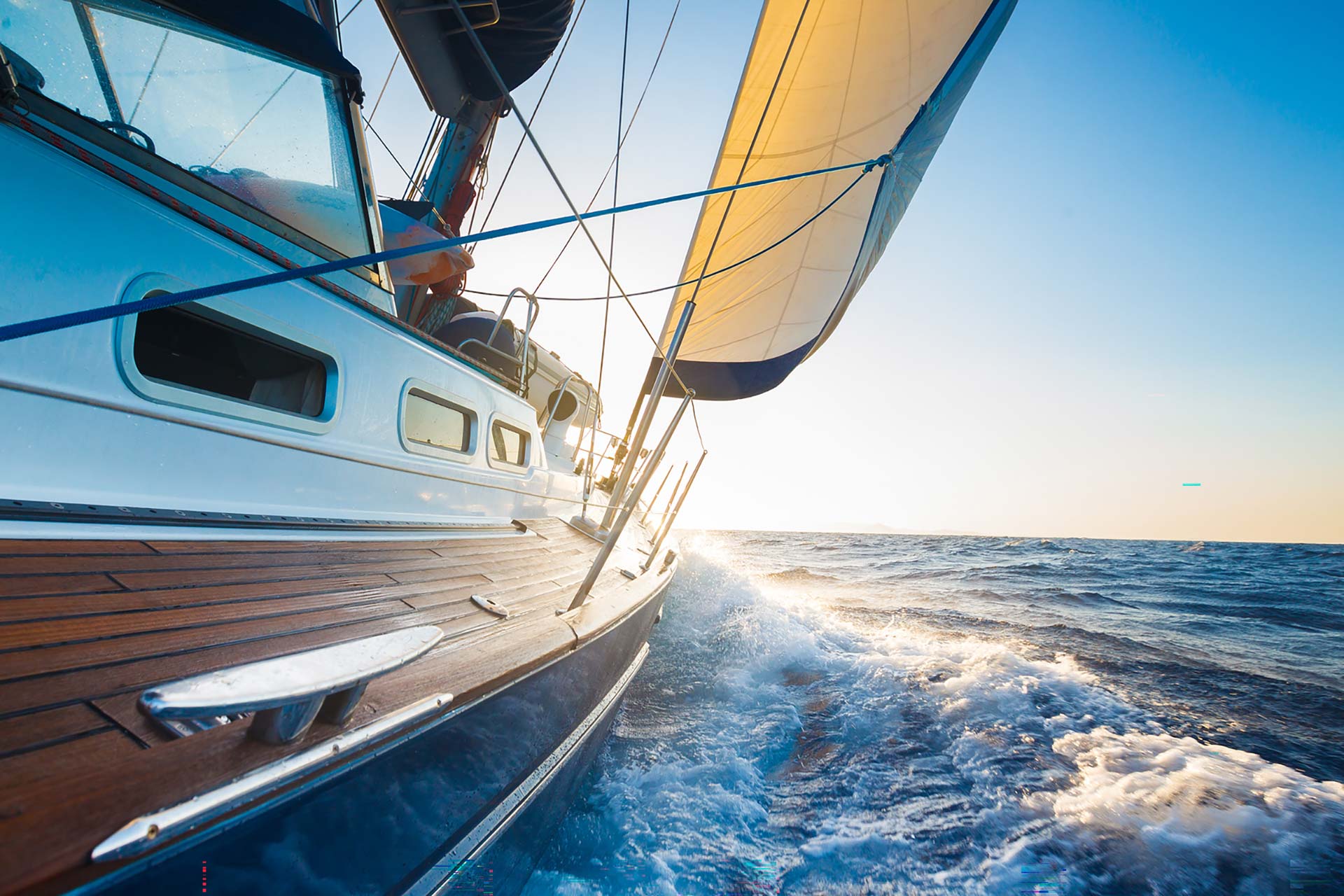 Boat on water with sunset in background